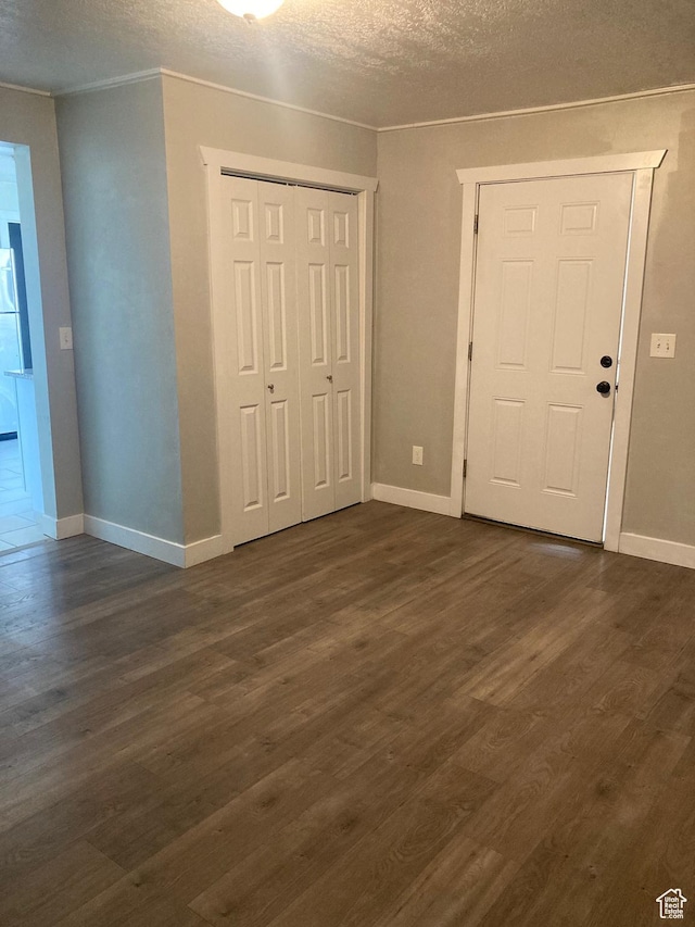 2855 Lincoln Ave, Ogden, UT 84401 - interior space with baseboards, dark wood-style flooring, a textured ceiling, and crown molding