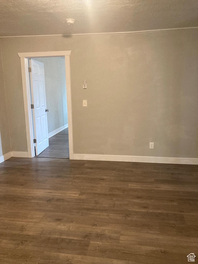 2855 Lincoln Ave, Ogden, UT 84401 - spare room featuring baseboards and dark wood-style flooring