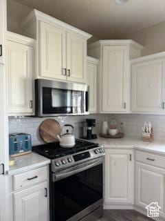 4190 W Delray N Unit 39, Vernal, UT 84078 - kitchen with light countertops, decorative backsplash, and stainless steel appliances
