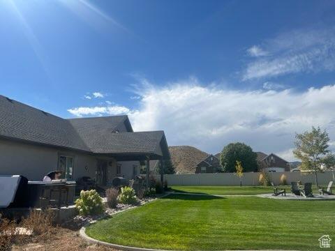 4190 W Delray N Unit 39, Vernal, UT 84078 - view of yard with fence and a patio
