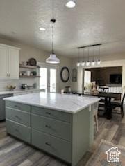 4190 W Delray N Unit 39, Vernal, UT 84078 - kitchen featuring gray cabinets, wood finished floors, open shelves, and a spacious island