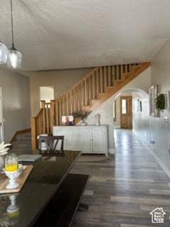 4190 W Delray N Unit 39, Vernal, UT 84078 - living room with arched walkways, stairway, and baseboards