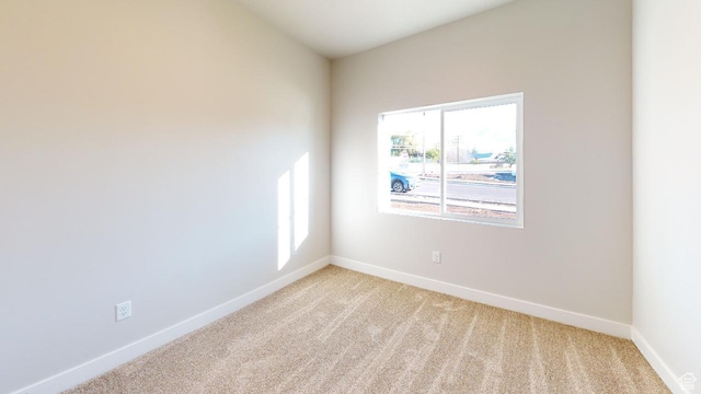 2696 W 2495 S Unit 207, Syracuse, UT 84075 - unfurnished room featuring baseboards and light carpet