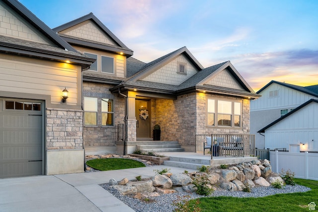 86 E 1675 S, Farmington, UT 84025 - view of front of home with roof with shingles, fence, a garage, and stone siding