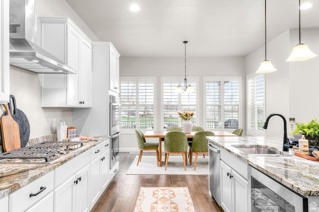 86 E 1675 S, Farmington, UT 84025 - kitchen with a sink, stainless steel appliances, a healthy amount of sunlight, wall chimney exhaust hood, and beverage cooler