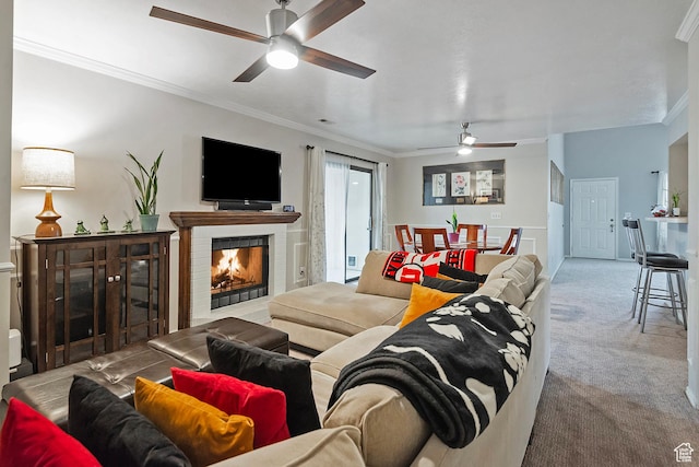 1077 E Deerwalk Ln S, Ogden, UT 84404 - carpeted living room featuring a lit fireplace, ceiling fan, and crown molding