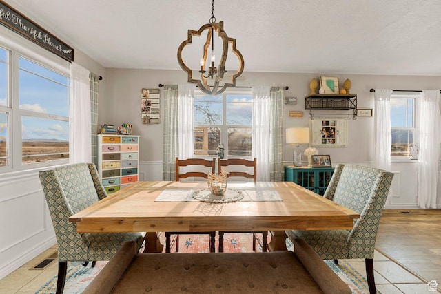 6832 W 1500 N, Cedar City, UT 84721 - dining area with a notable chandelier, visible vents, a decorative wall, and a textured ceiling