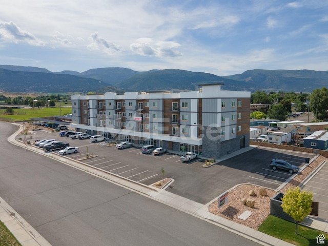 76 E 450 N, Ephraim, UT 84627 - view of building exterior with a mountain view and uncovered parking