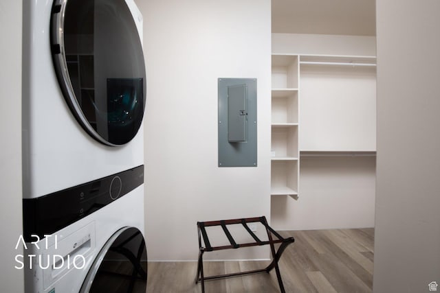 76 E 450 N, Ephraim, UT 84627 - washroom featuring electric panel, wood finished floors, stacked washer and clothes dryer, and laundry area
