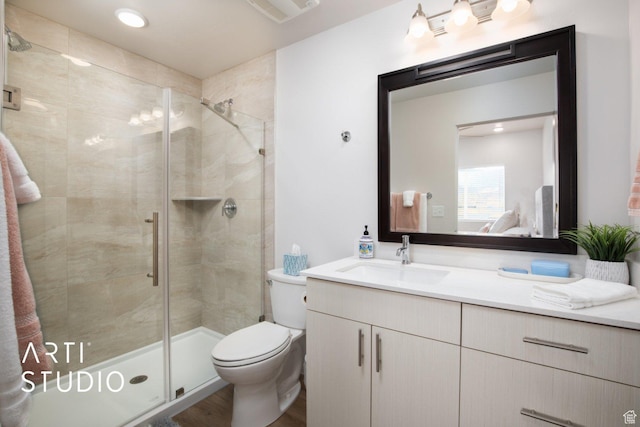 76 E 450 N, Ephraim, UT 84627 - full bathroom featuring a stall shower, toilet, vanity, wood finished floors, and visible vents