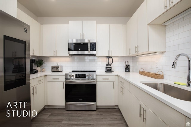 76 E 450 N, Ephraim, UT 84627 - kitchen with backsplash, light countertops, a sink, and appliances with stainless steel finishes