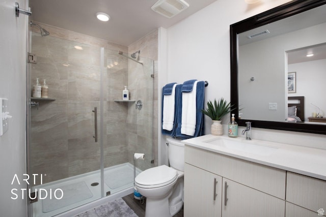 76 E 450 N, Ephraim, UT 84627 - bathroom featuring visible vents, toilet, vanity, and a stall shower