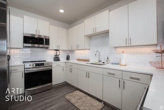 76 E 450 N, Ephraim, UT 84627 - kitchen featuring a sink, light countertops, decorative backsplash, and appliances with stainless steel finishes