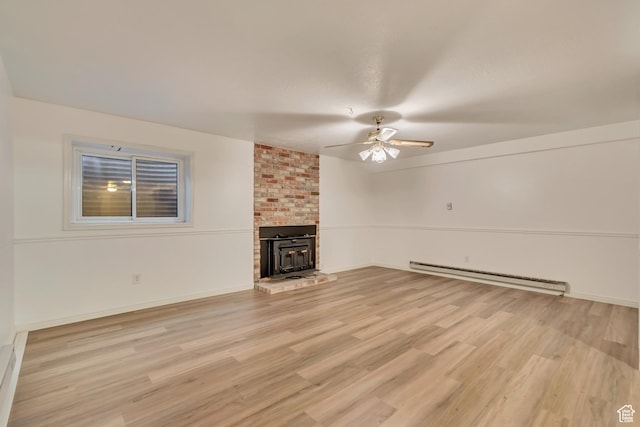 unfurnished living room featuring baseboards, light wood-style floors, a baseboard radiator, and a ceiling fan