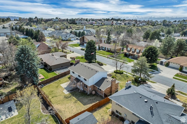 birds eye view of property with a residential view