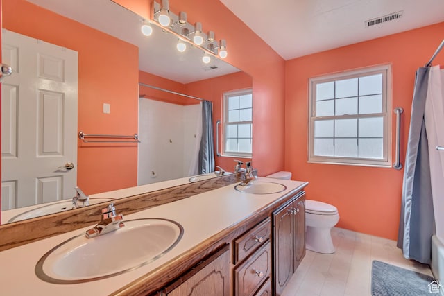 full bath featuring visible vents, a sink, and toilet
