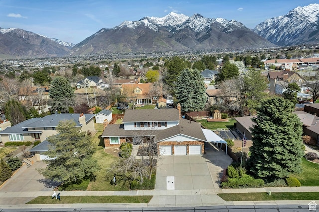 bird's eye view with a mountain view and a residential view