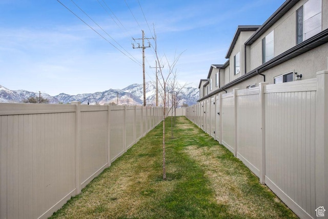 1960 W Jaydin Way S Unit 1, West Haven, UT 84401 - view of yard featuring a fenced backyard and a mountain view