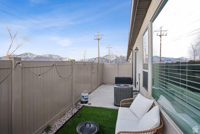 1960 W Jaydin Way S Unit 1, West Haven, UT 84401 - view of patio / terrace with a gate, central AC unit, a fenced backyard, and a mountain view