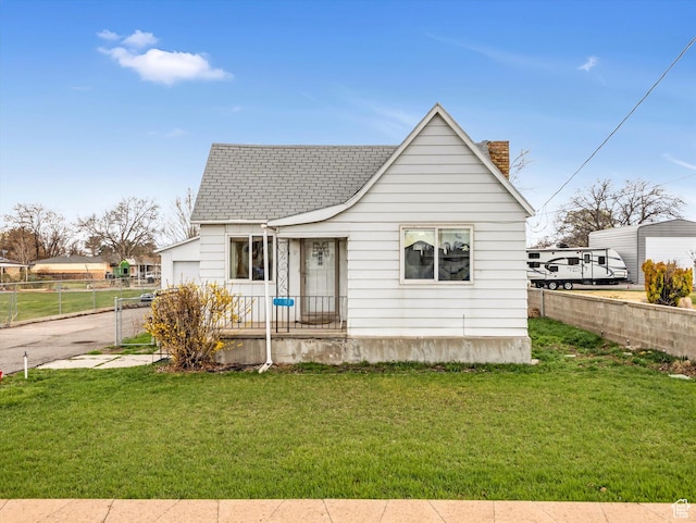 bungalow-style home with roof with shingles, a front yard, fence, and a chimney