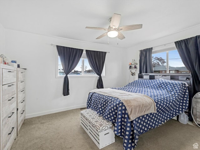 bedroom with carpet flooring, baseboards, and ceiling fan