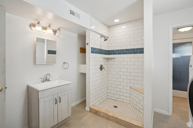 148 N Center St, Midway, UT 84049 - full bathroom featuring vanity, baseboards, a tile shower, and visible vents