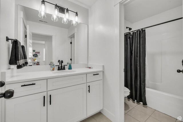 16132 S Coupler Ln Unit 406, Bluffdale, UT 84065 - bathroom with shower / bath combo, toilet, tile patterned floors, and vanity