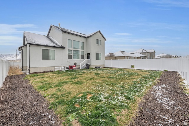 16132 S Coupler Ln Unit 406, Bluffdale, UT 84065 - back of house with a fenced backyard, a lawn, and stucco siding