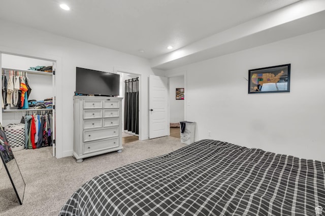 16132 S Coupler Ln Unit 406, Bluffdale, UT 84065 - bedroom featuring a closet, a spacious closet, recessed lighting, and light colored carpet