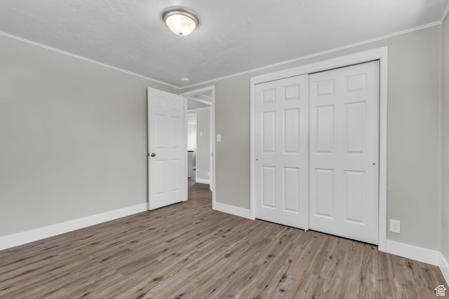 2620 S 8590 W, Magna, UT 84044 - unfurnished bedroom with baseboards, wood finished floors, and crown molding