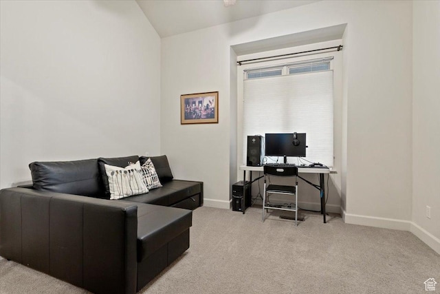 living room with light carpet and baseboards