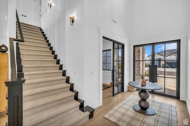 697 E Margarita Way, Washington, UT 84780 - stairs with a high ceiling, visible vents, baseboards, and wood finished floors