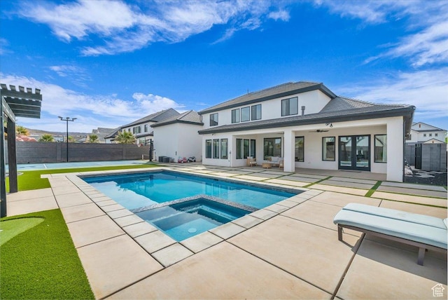 697 E Margarita Way, Washington, UT 84780 - rear view of property featuring stucco siding, a patio, a fenced backyard, ceiling fan, and a pool with connected hot tub