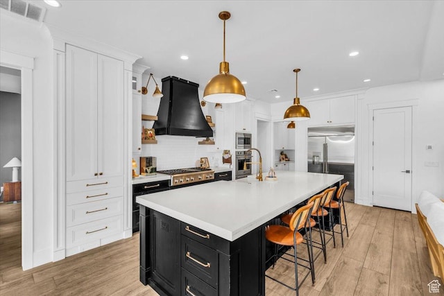 697 E Margarita Way, Washington, UT 84780 - kitchen with light countertops, ventilation hood, white cabinetry, built in appliances, and dark cabinets