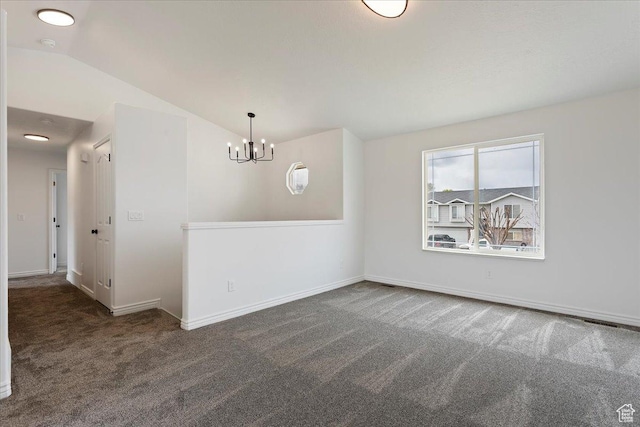 unfurnished dining area with a chandelier, carpet floors, baseboards, and vaulted ceiling