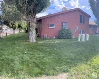 1450 N Sagewood Rd E Unit 17, Price, UT 84501 - exterior space with a lawn and a chimney