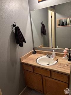 1450 N Sagewood Rd E Unit 17, Price, UT 84501 - bathroom featuring a textured wall and vanity