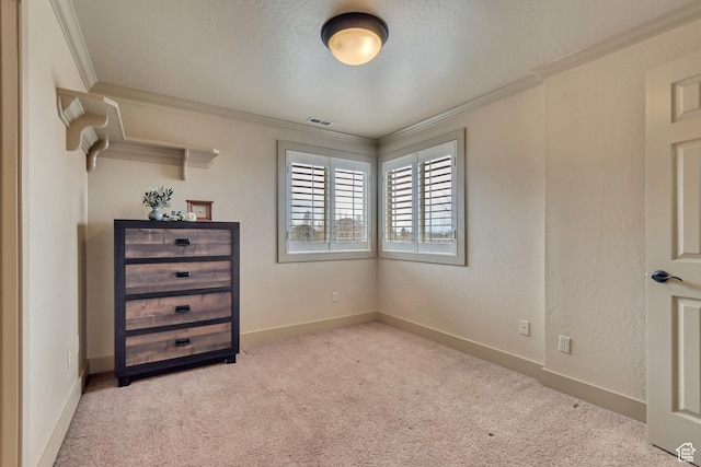 carpeted bedroom featuring crown molding, baseboards, and visible vents