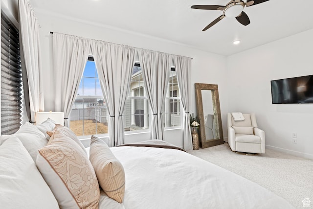 carpeted bedroom with a ceiling fan, baseboards, and recessed lighting