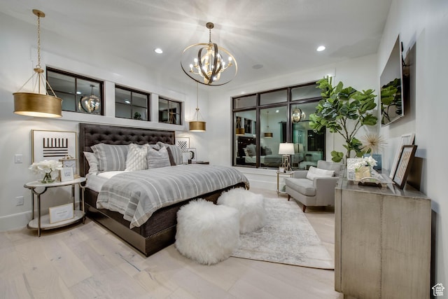 bedroom with wood finished floors, baseboards, a chandelier, and recessed lighting