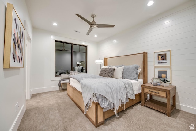 bedroom featuring a ceiling fan, baseboards, light colored carpet, and recessed lighting