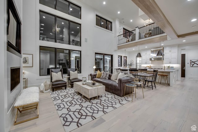 living room with recessed lighting and light wood finished floors