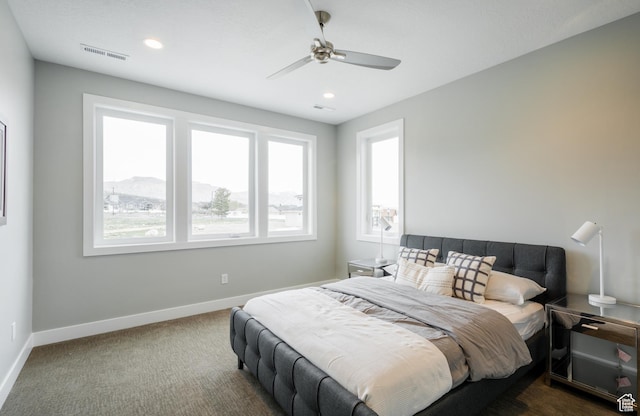 bedroom with dark carpet, baseboards, visible vents, ceiling fan, and recessed lighting