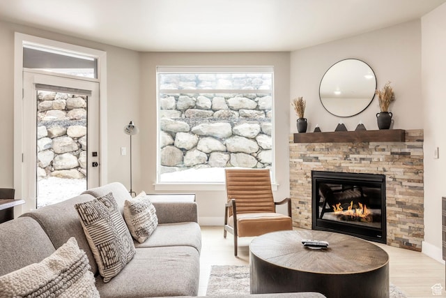 909 W Peace Tree Trl Unit 206, Kamas, UT 84036 - living room with a stone fireplace, baseboards, and wood finished floors