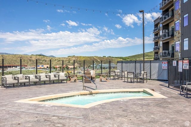 909 W Peace Tree Trl Unit 206, Kamas, UT 84036 - view of swimming pool with a community hot tub, a mountain view, and fence