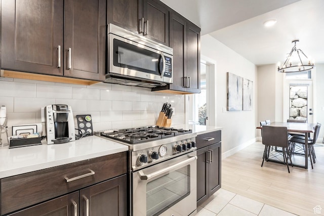 909 W Peace Tree Trl Unit 206, Kamas, UT 84036 - kitchen with plenty of natural light, tasteful backsplash, light countertops, and stainless steel appliances