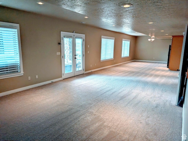 2524 E 700 S, Springville, UT 84663 - interior space with recessed lighting, baseboards, a chandelier, a textured ceiling, and light carpet