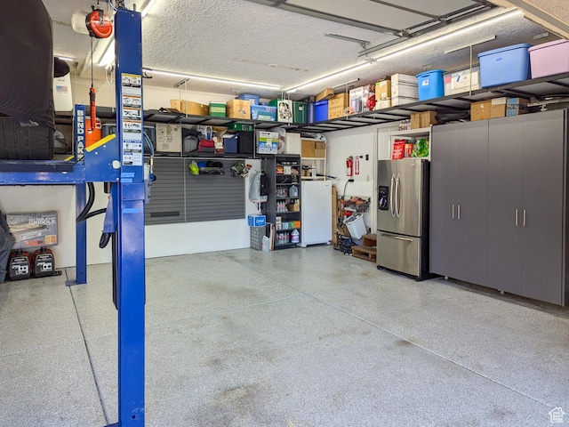 2524 E 700 S, Springville, UT 84663 - garage featuring stainless steel fridge with ice dispenser and freestanding refrigerator