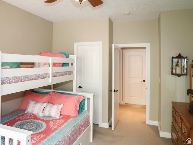 2524 E 700 S, Springville, UT 84663 - bedroom featuring ceiling fan, baseboards, light colored carpet, and a textured ceiling