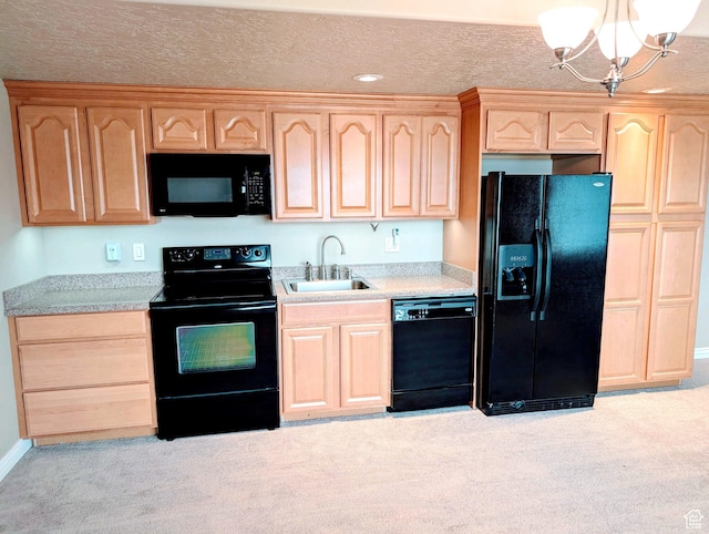 2524 E 700 S, Springville, UT 84663 - kitchen with light countertops, a sink, a chandelier, light brown cabinets, and black appliances
